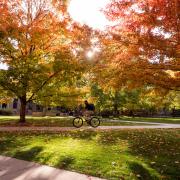 Student rides bike across campus