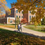 Students walking on campus during fall