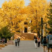 students walking on campus during fall