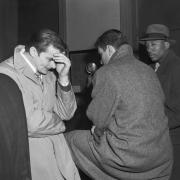 Basketball players, arrested for bribery in 1951, at a police station