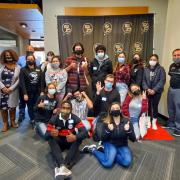 Group of first-generation students pose for photos