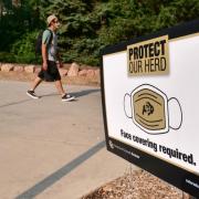 A person walks near the UMC during the first week of classes in the midst of the COVID-19 pandemic. (Photo by Casey A. Cass/University of Colorado)