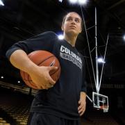 Haley Smith poses with basketball in hand on court