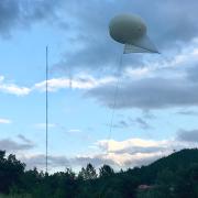 Tethered balloon kite above the trees in Portugal