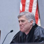 Neil Gorsuch sits at a courtroom bench. (Photo courtesy of Colorado Law.)