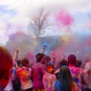 Holi festival with brightly colored clay on campus
