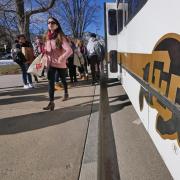 Students exit a Buff Bus on campus