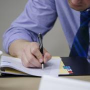 Employee writing in notebook during a workshop