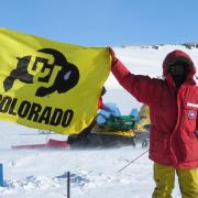 Brian Hynek with CU Boulder flag