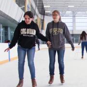 Families ice skating at the CU Boulder Rec Center Ice Rink