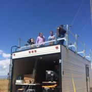 Greg Rieker, project with team members while atop their mobile laboratory in rural Colorado