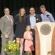 Kennedy Leonard (second from left) and Wilson Belk (far right) accept their Sports Performance Awards from strength coaches Adam Ringler and Steve Englehart.