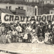 A 1921 photo of children with a large Chautauqua sign