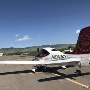 an airplane on the runway at boulder municipal airport