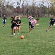 CU Boulder students playing soccer.