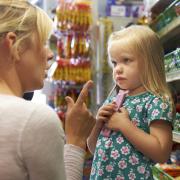 Woman talking to her young daughter