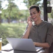 person laughing on the phone