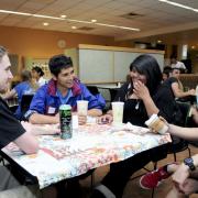 Students chat at International Coffee Hour in the UMC