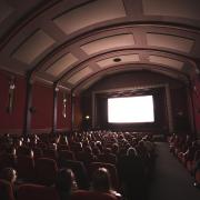 people watching a film in a theater