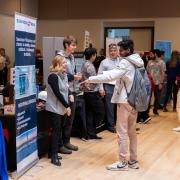 Students visiting booths at the Just in Time career fair