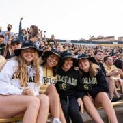 students at football game