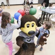 Kids have fun with Chip and balloons at Campus Kids Day