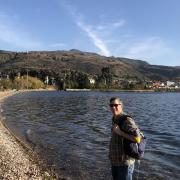 Patrick Kociolek standing on the shore of a lake