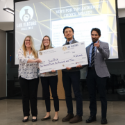 Winners hold a large Lab Venture Challenge check.