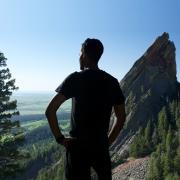 Man standing on mountain top.