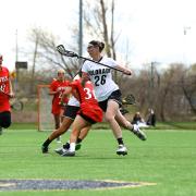 Maddie DeWinter on field during lacrosse game