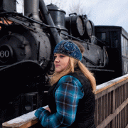 Megan Mangum stands by train reflecting on past