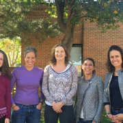 The team of grant recipients, five women from Mental Health Partners and CU Boulder, stand in a row and pose for a photo, smiling.