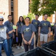 Volunteers gather for a photo during move-in