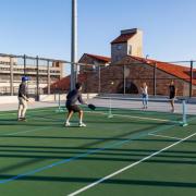 Students playing tennis.