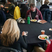 Seminar attendees sit at round table