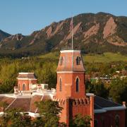 Old Main and the Flatirons.