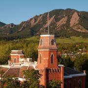 Old Main with the Flatirons in the background
