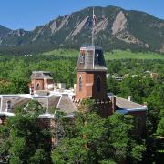 Old Main building with the Flatirons in the background.