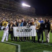 LASP team and Chip the buffalo mascot on Folsom Field