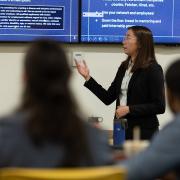 Grace Vaughn walks a panel of judges, including two CU alumni from Optera, through her team's recommendations