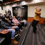 Angie Paccione speaks to members of the women’s basketball team during her visit