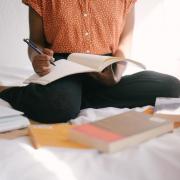 person studying on bed