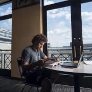 CU Buffaloes football running back Phillip Lindsay studies in the Dal Ward Center located next to Folsom Field. (Photo by Glenn Asakawa/University of Colorado)