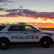 A CUPD squad car at sunrise