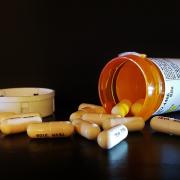 Prescription medication spilled out on table