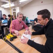 Faculty member working with a student