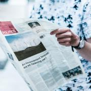 Man holding newspaper 