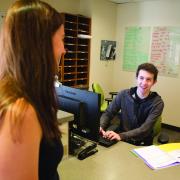 Student talks with residence hall advisor