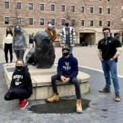 Student volunteers in masks on the CU Boulder campus