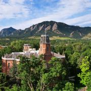 Old Main building with the Flatirons in the background.